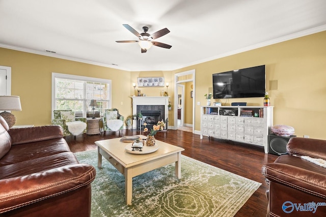 126 Mattie Ct, Madison, AL 35756 - living room with ceiling fan, crown molding, a tiled fireplace, and wood finished floors