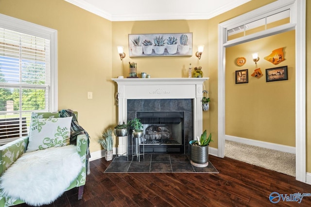 126 Mattie Ct, Madison, AL 35756 - living area with ornamental molding, a tiled fireplace, and wood finished floors