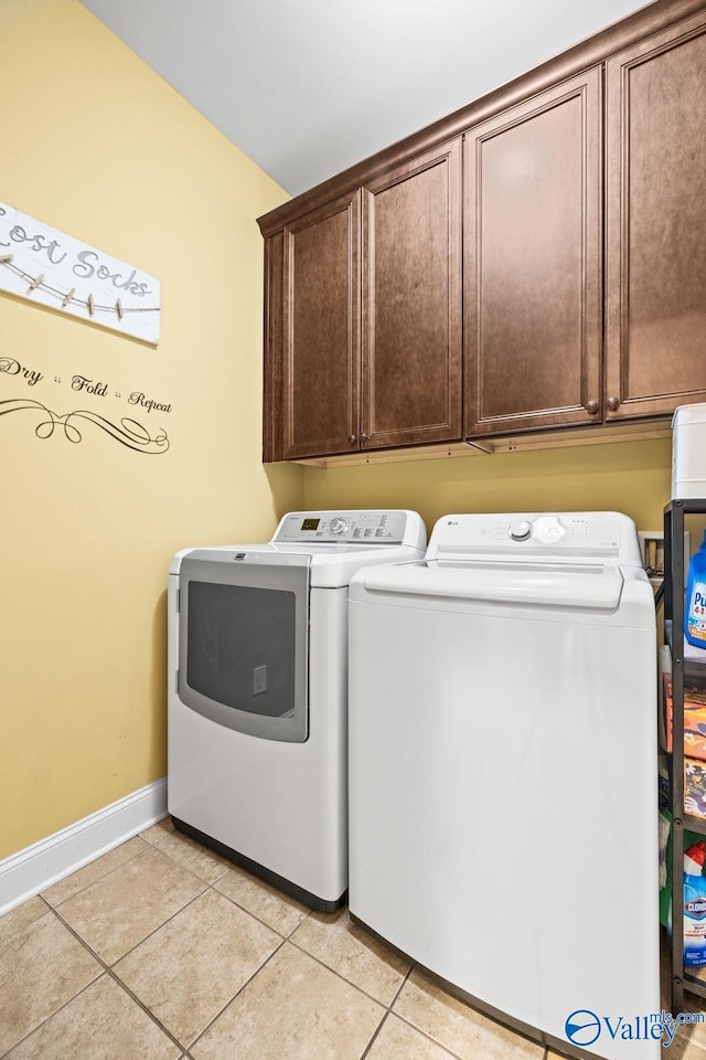 126 Mattie Ct, Madison, AL 35756 - washroom featuring cabinet space, washing machine and dryer, and light tile patterned flooring