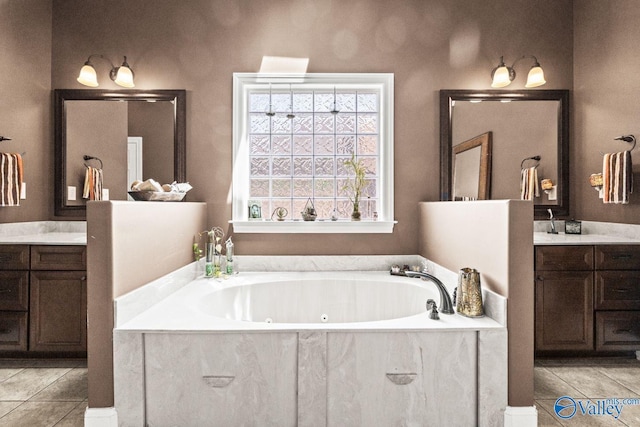126 Mattie Ct, Madison, AL 35756 - bathroom with tile patterned floors, vanity, and a whirlpool tub