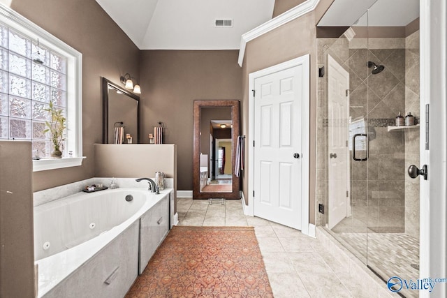 126 Mattie Ct, Madison, AL 35756 - bathroom featuring a tub with jets, a shower stall, lofted ceiling, and tile patterned floors