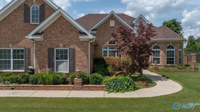 126 Mattie Ct, Madison, AL 35756 - traditional-style home featuring brick siding, a front lawn, and roof with shingles