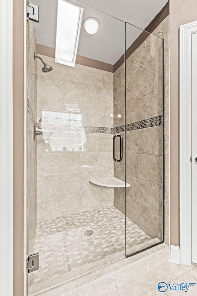 126 Mattie Ct, Madison, AL 35756 - bathroom with a stall shower and tile patterned flooring