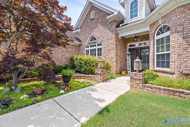 126 Mattie Ct, Madison, AL 35756 - entrance to property with brick siding and a porch