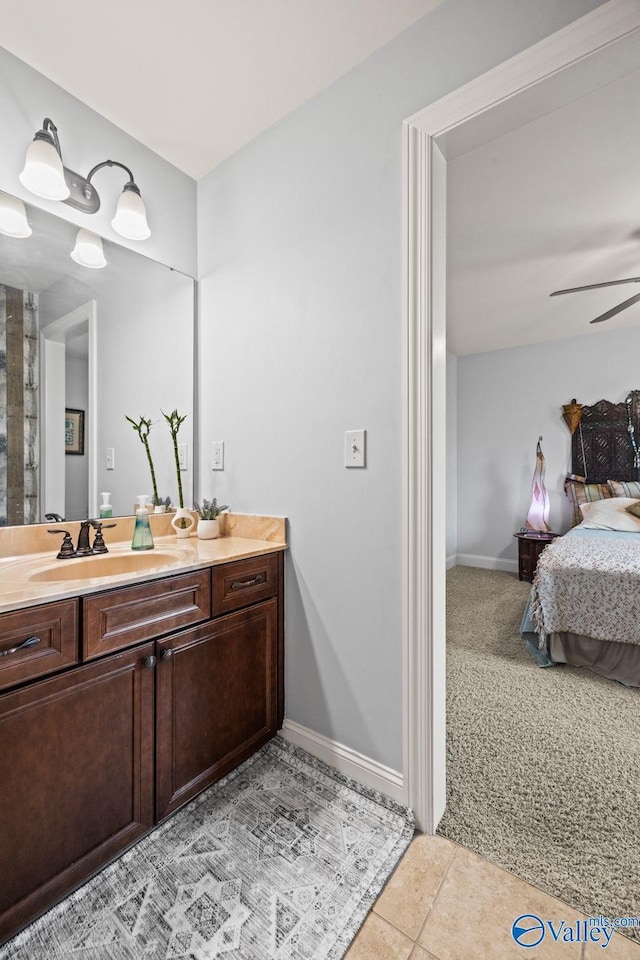 126 Mattie Ct, Madison, AL 35756 - ensuite bathroom with vanity, ceiling fan, and tile patterned flooring