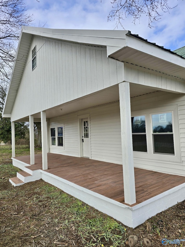 rear view of property with a deck