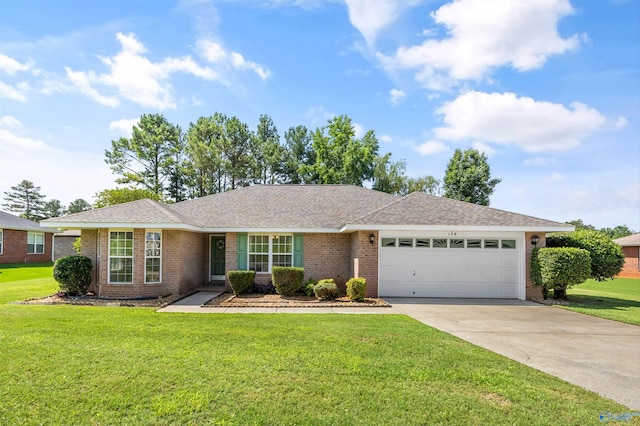 170 Jarrett Ln, Madison, AL 35758 - single story home featuring a garage, brick siding, concrete driveway, and a front lawn