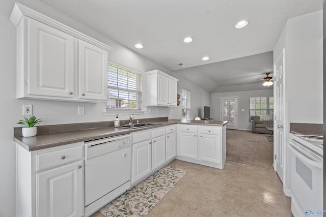 170 Jarrett Ln, Madison, AL 35758 - kitchen featuring white appliances, open floor plan, a peninsula, light colored carpet, and recessed lighting