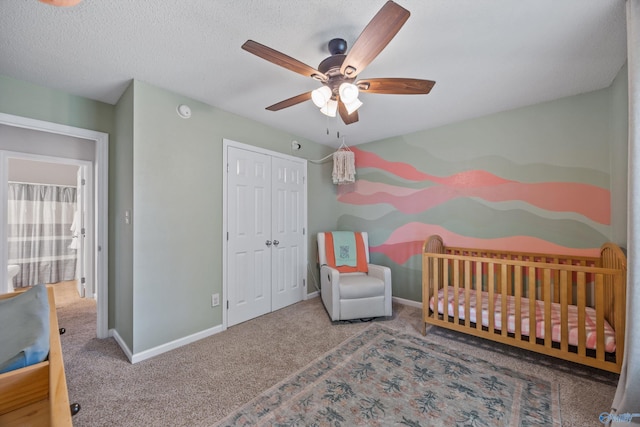 170 Jarrett Ln, Madison, AL 35758 - carpeted bedroom featuring a closet, a ceiling fan, and a nursery area