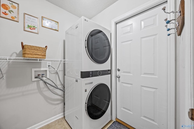 170 Jarrett Ln, Madison, AL 35758 - washroom with stacked washing machine and dryer and a textured ceiling