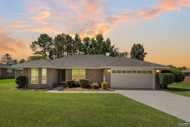 170 Jarrett Ln, Madison, AL 35758 - single story home featuring concrete driveway, a garage, a lawn, and brick siding