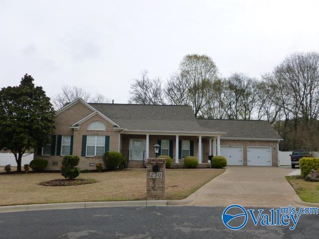 ranch-style house with an attached garage, concrete driveway, crawl space, brick siding, and a front lawn