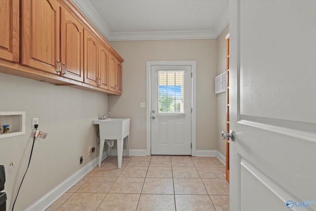 laundry room featuring hookup for an electric dryer, light tile patterned floors, ornamental molding, hookup for a washing machine, and cabinet space