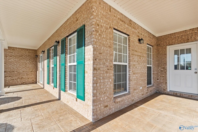 exterior space with brick siding