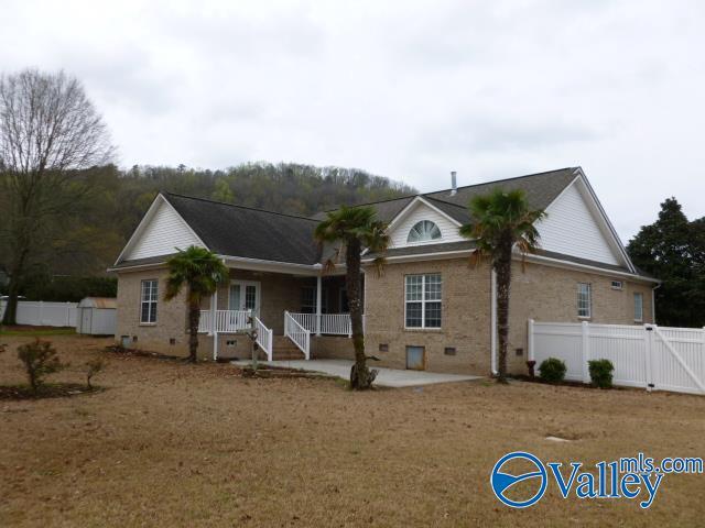 back of property with a gate, crawl space, fence, and a patio