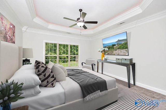 bedroom with ceiling fan, crown molding, and a tray ceiling