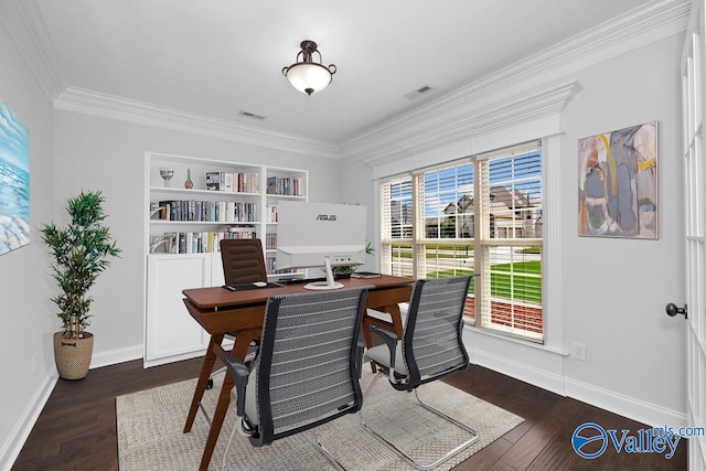 dining room featuring dark hardwood / wood-style floors, built in features, and ornamental molding