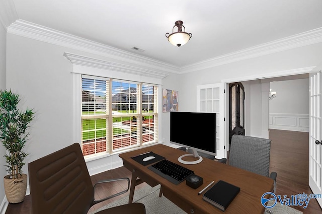 office space with wood-type flooring and ornamental molding