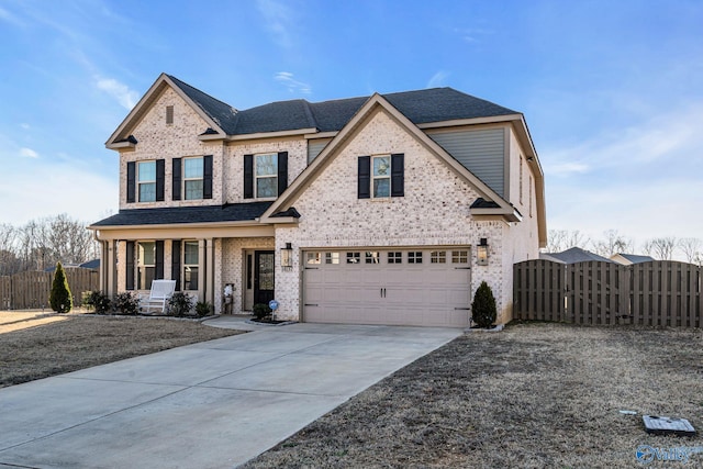 view of front of property with driveway, an attached garage, covered porch, a gate, and fence