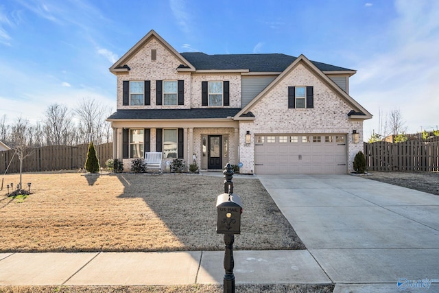 traditional-style home featuring driveway, an attached garage, covered porch, fence, and brick siding