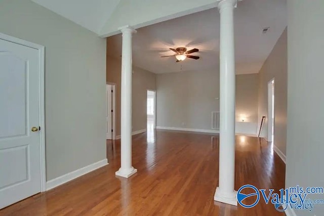 empty room featuring ceiling fan and hardwood / wood-style flooring