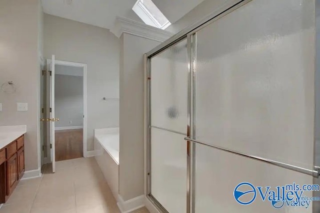 bathroom with tile patterned floors, vanity, lofted ceiling, and plus walk in shower