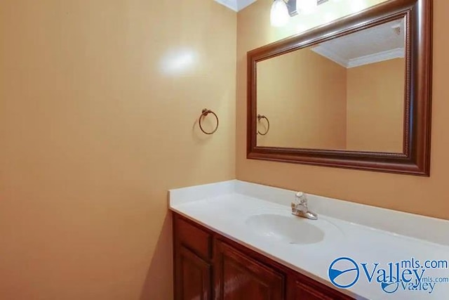 bathroom featuring vanity and crown molding