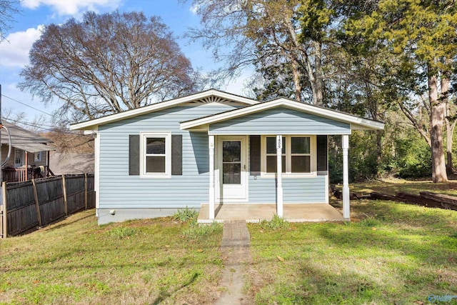 bungalow-style home with a front lawn