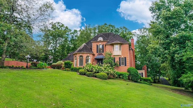 904 Driver Rd NW, Fort Payne, AL 35967 - view of front facade with a front lawn, brick siding, and a chimney