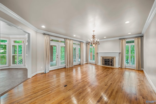 904 Driver Rd NW, Fort Payne, AL 35967 - unfurnished living room with an inviting chandelier, light wood-style flooring, recessed lighting, and baseboards