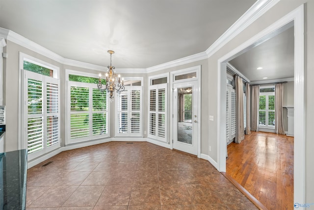 unfurnished dining area featuring crown molding, an inviting chandelier, and dark hardwood / wood-style flooring