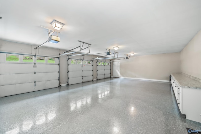 904 Driver Rd NW, Fort Payne, AL 35967 - garage with a garage door opener and baseboards