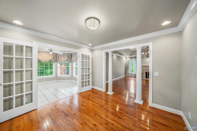 904 Driver Rd NW, Fort Payne, AL 35967 - unfurnished room featuring crown molding, baseboards, hardwood / wood-style floors, ornate columns, and a ceiling fan