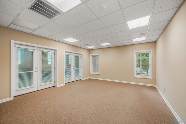 904 Driver Rd NW, Fort Payne, AL 35967 - carpeted spare room featuring visible vents, french doors, a paneled ceiling, and baseboards