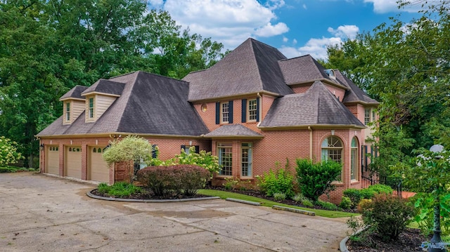 904 Driver Rd NW, Fort Payne, AL 35967 - view of front facade featuring brick siding, an attached garage, concrete driveway, and a shingled roof