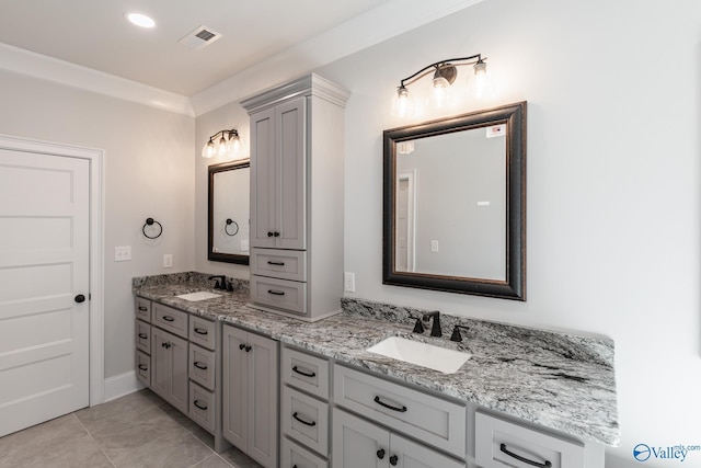 20020 Capitol Hill Dr, Tanner, AL 35671 - bathroom featuring crown molding, visible vents, a sink, and double vanity
