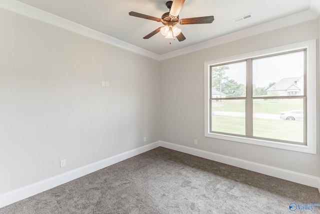 20020 Capitol Hill Dr, Tanner, AL 35671 - spare room featuring baseboards, visible vents, a ceiling fan, ornamental molding, and dark carpet