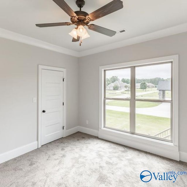 20020 Capitol Hill Dr, Tanner, AL 35671 - unfurnished room with light colored carpet, visible vents, ornamental molding, a ceiling fan, and baseboards