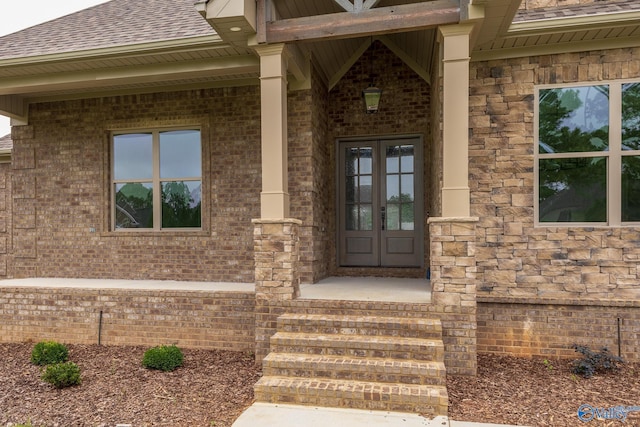20020 Capitol Hill Dr, Tanner, AL 35671 - doorway to property featuring stone siding, a shingled roof, brick siding, and french doors