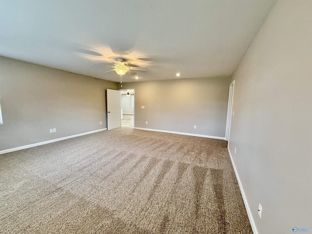 carpeted empty room with ceiling fan