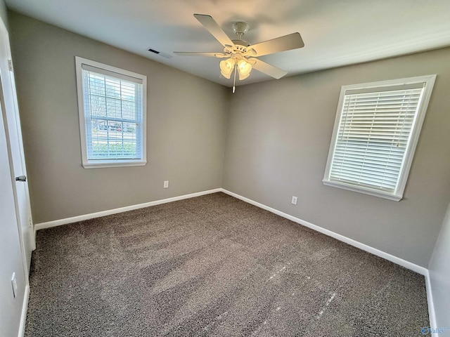 spare room with ceiling fan and carpet flooring