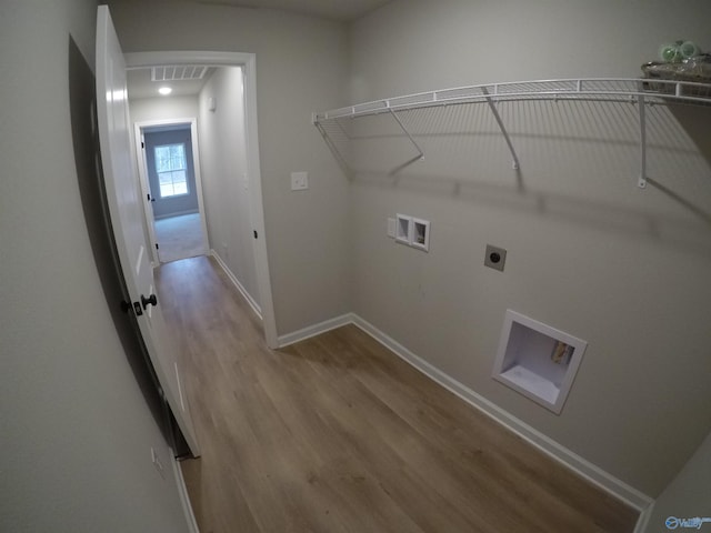 clothes washing area with washer hookup, hookup for an electric dryer, and hardwood / wood-style floors