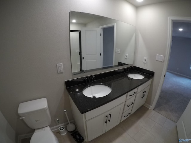 bathroom featuring vanity and toilet