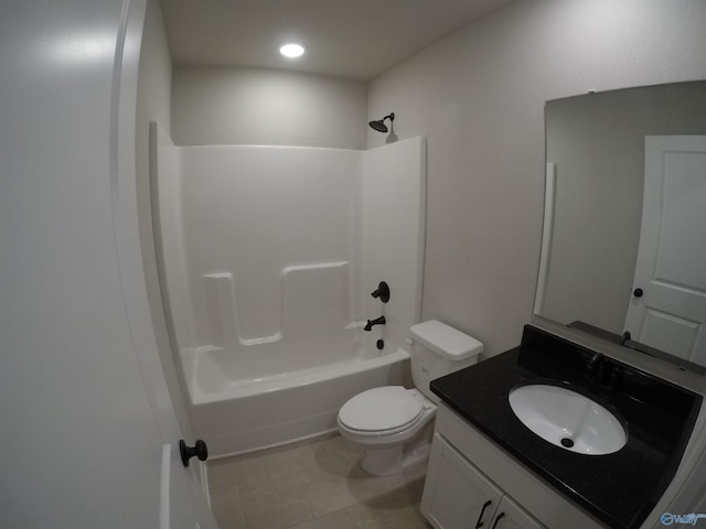 full bathroom with tile patterned floors, shower / washtub combination, toilet, and vanity