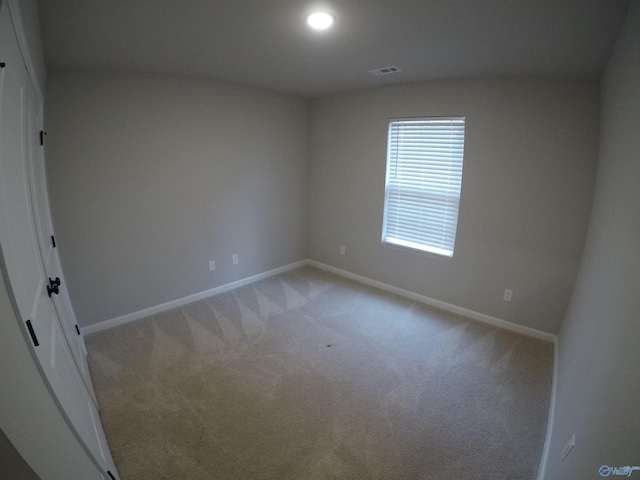 view of carpeted spare room