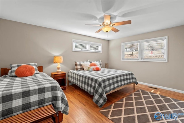 bedroom featuring ceiling fan and light hardwood / wood-style floors