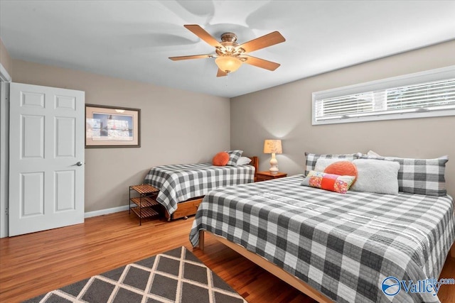 bedroom featuring ceiling fan and hardwood / wood-style floors