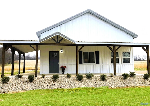 view of front of property featuring a porch and metal roof