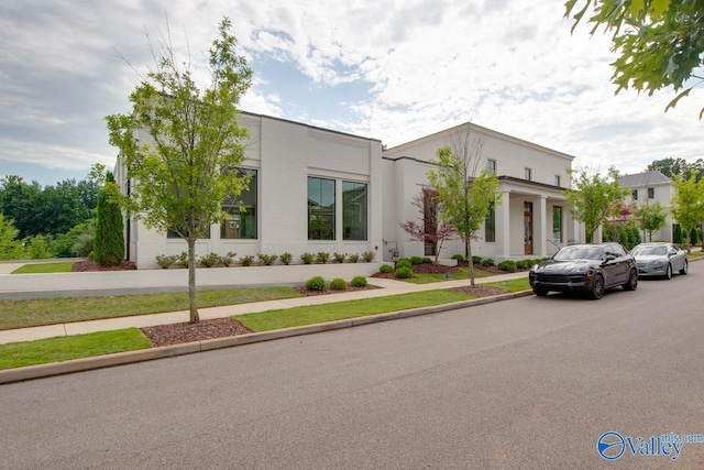 contemporary house featuring stucco siding