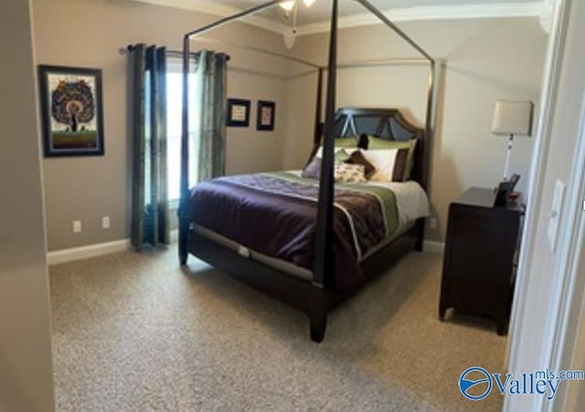 bedroom with multiple windows, baseboards, and carpet flooring